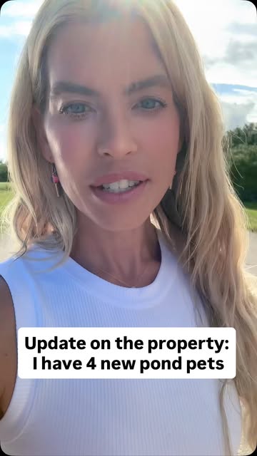 Melissa's property with a pond and pets, filmed vertically.